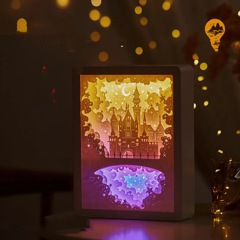 Bedside night light with 3D paper carving design, USB cable, and remote control on wooden surface