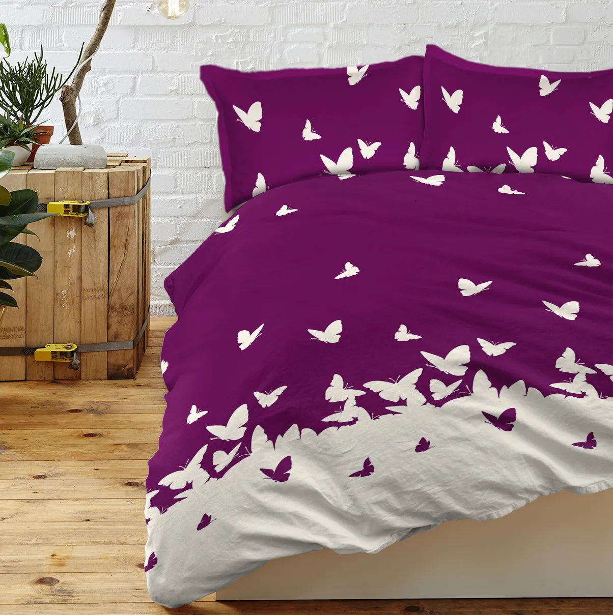 Purple butterfly reversible microfiber comforter set with two pillow shams on bed