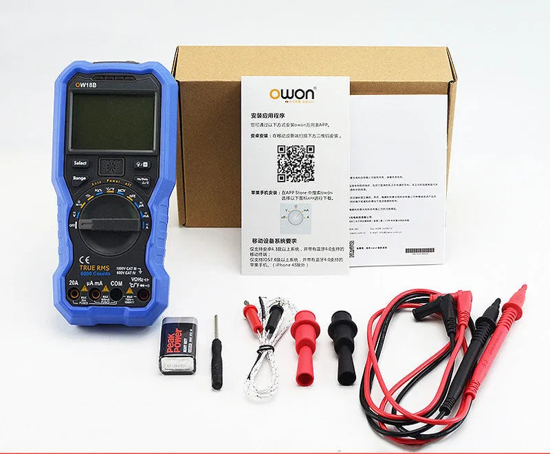 Handheld digital multimeter on a workbench with test leads, showing a large LCD display.