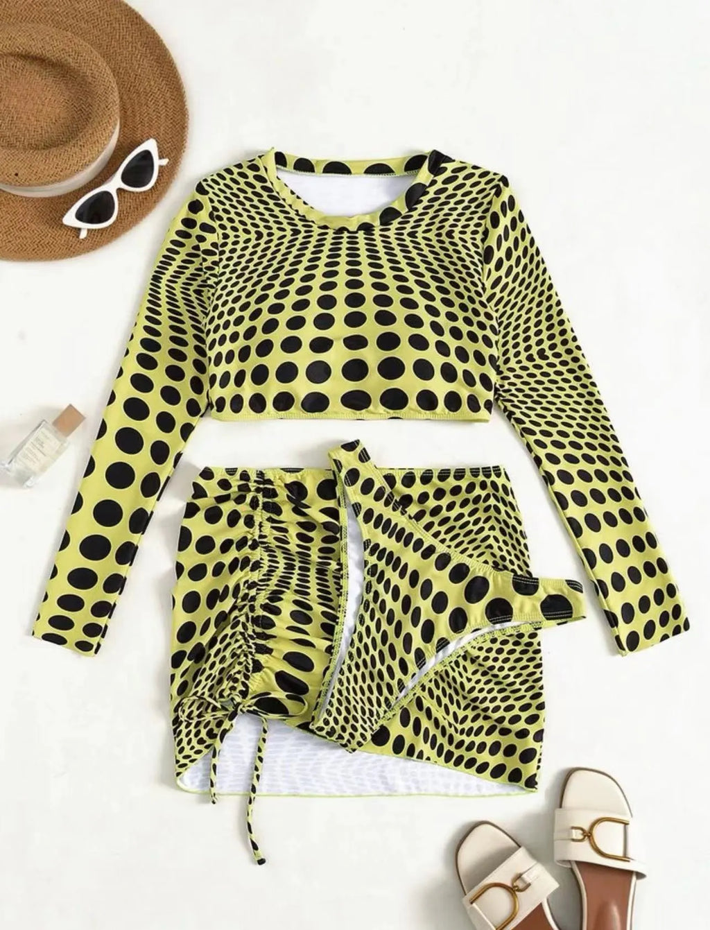 Women's green polka dot swimsuit three-piece set showing top, skirt, and bra.