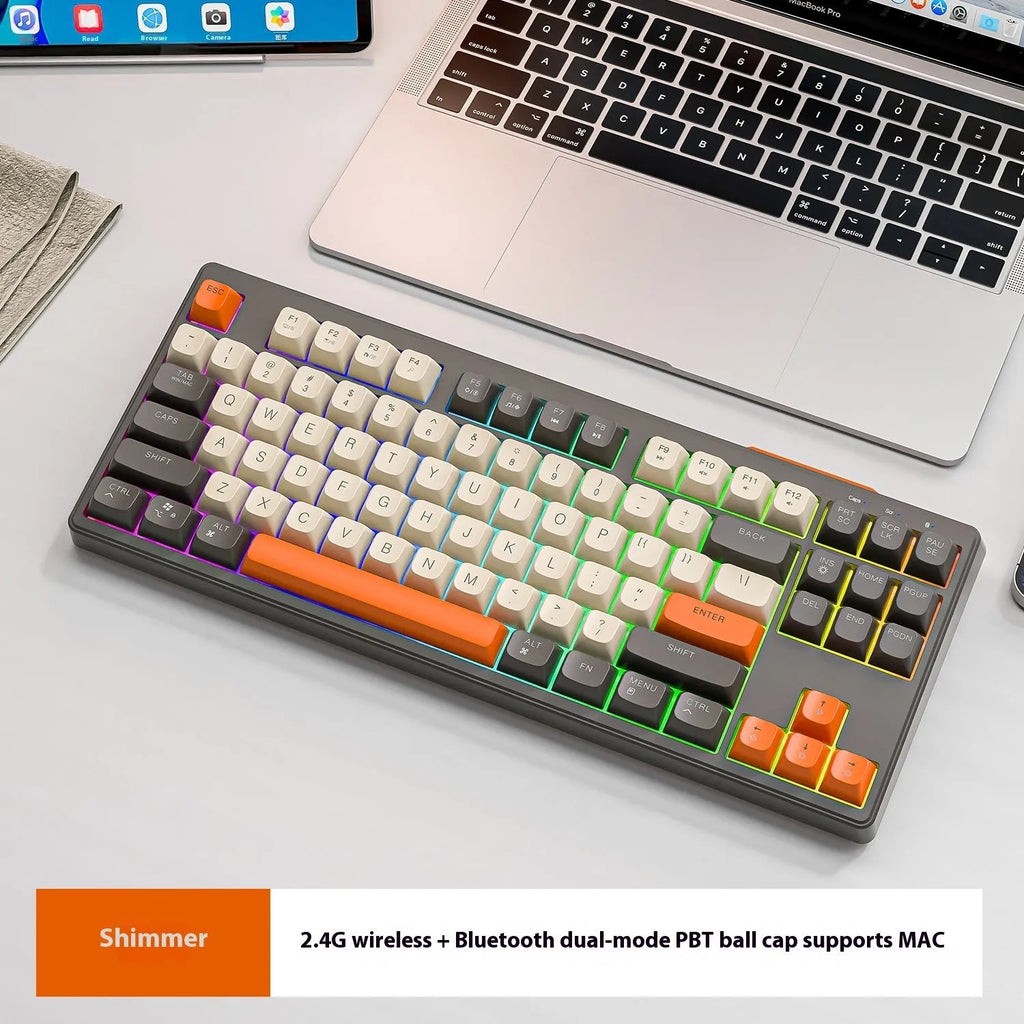 Free Wolf M87 wireless Bluetooth keyboard in blueberry colour on a wooden desk