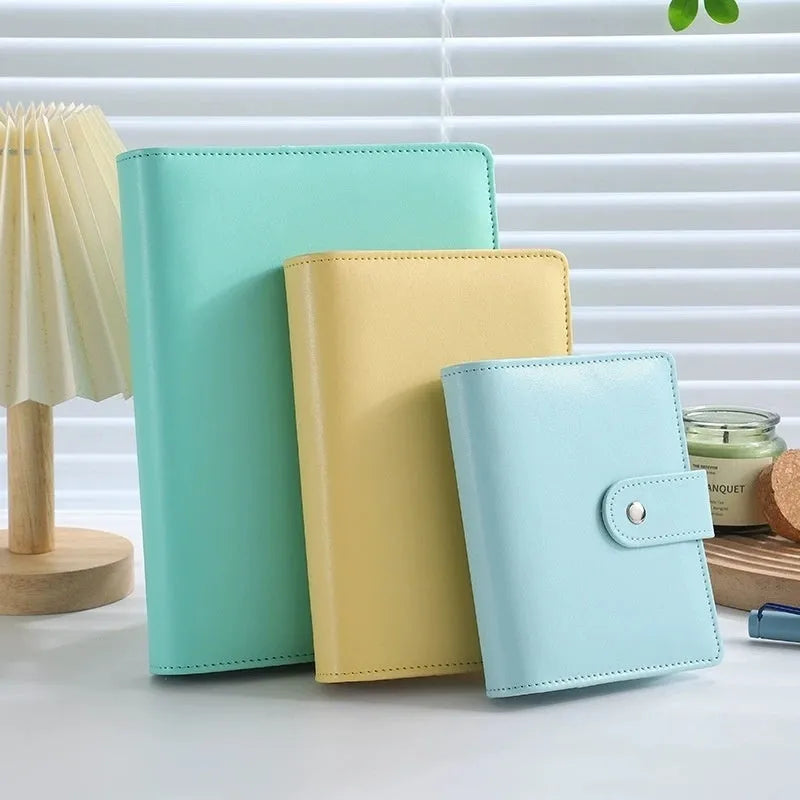 A5 PU leather notebook binder shell with zipper closed, shown in a selection of solid colours.