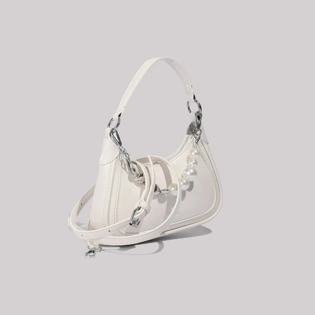 White PU crossbody shoulder bag with vertical square shape, three-dimensional outer pocket, and phone compartment.