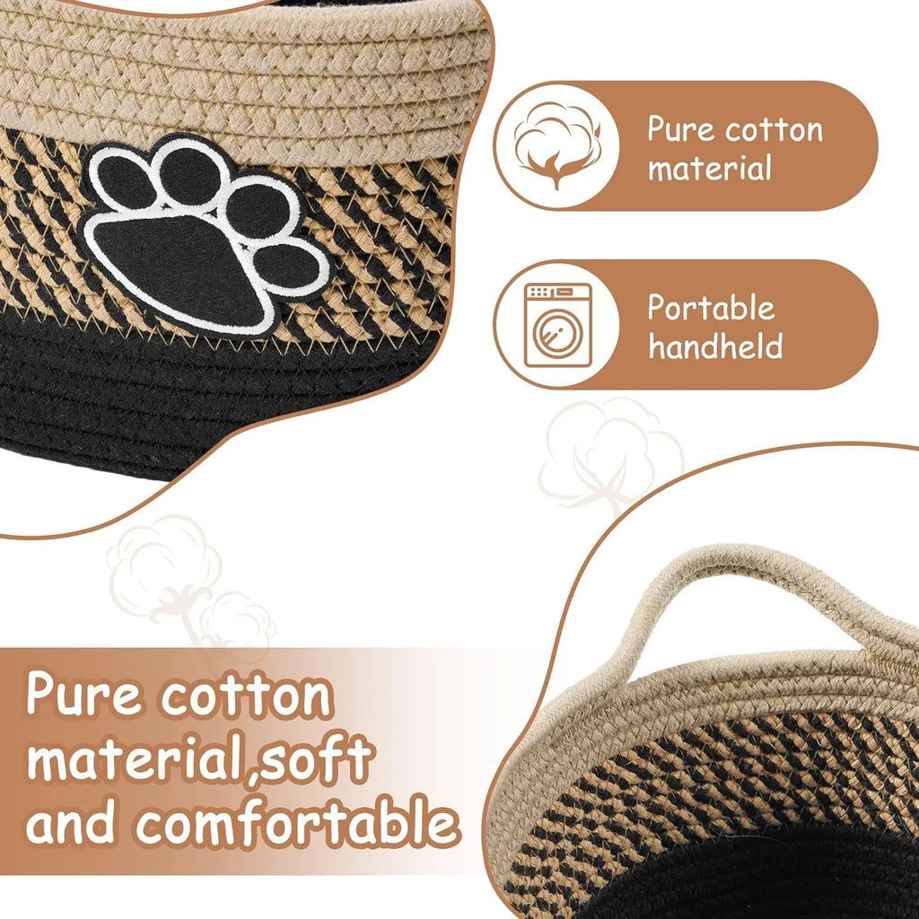 Light beige handmade cotton rope storage basket with wooden base and handle on a wooden floor