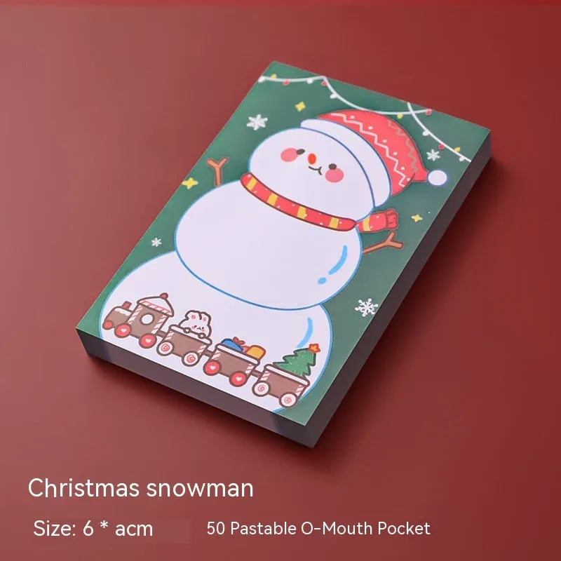 Christmas cartoon sticky notes pad with festive designs including Santa Claus and snowman