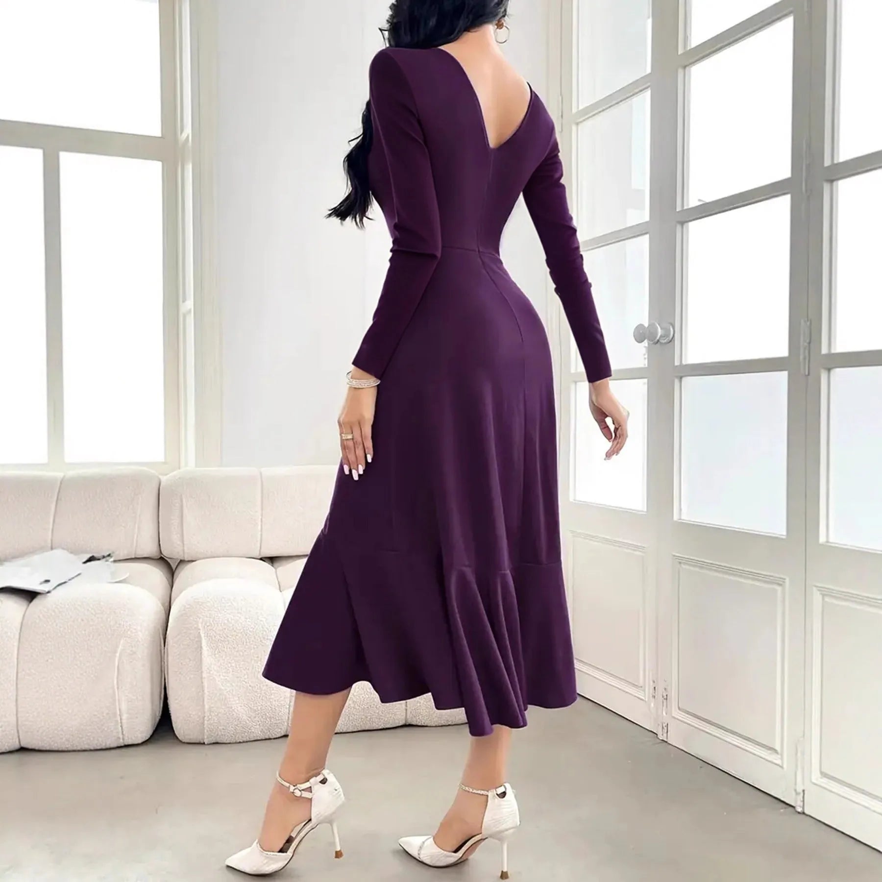 Purple women's long sleeve dress with ruffles and a round neck, shown on a mid-waist fit model.