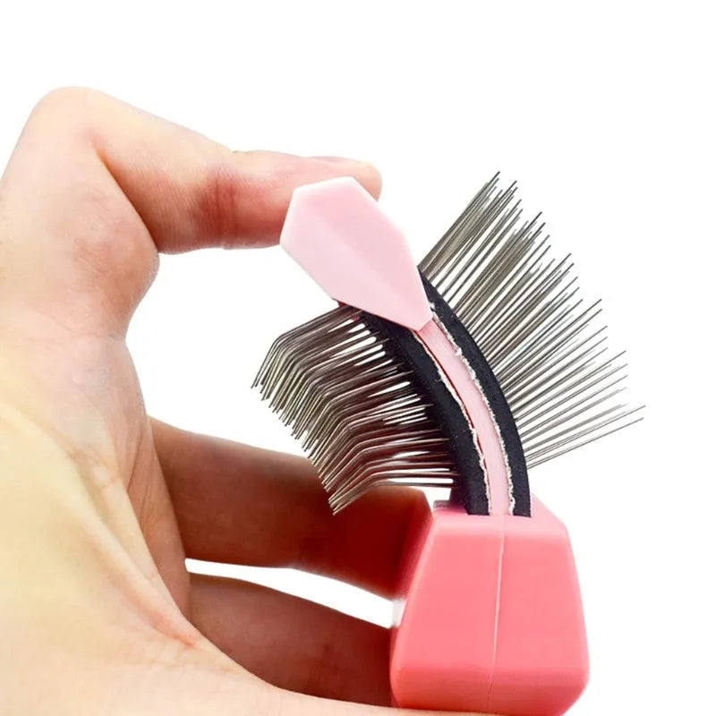 Blue and pink double-sided pet brushes showing soft bristles and stainless steel pins on a non-slip handle.