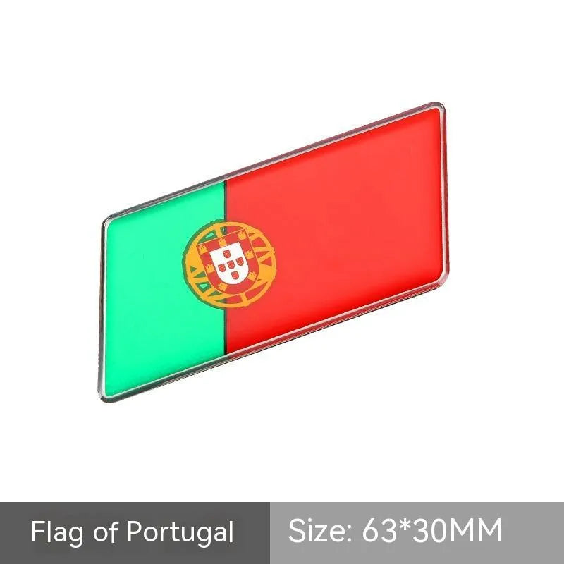 Aluminium national flag car sticker in a parallelogram shape measuring 6.3 by 3 centimetres.