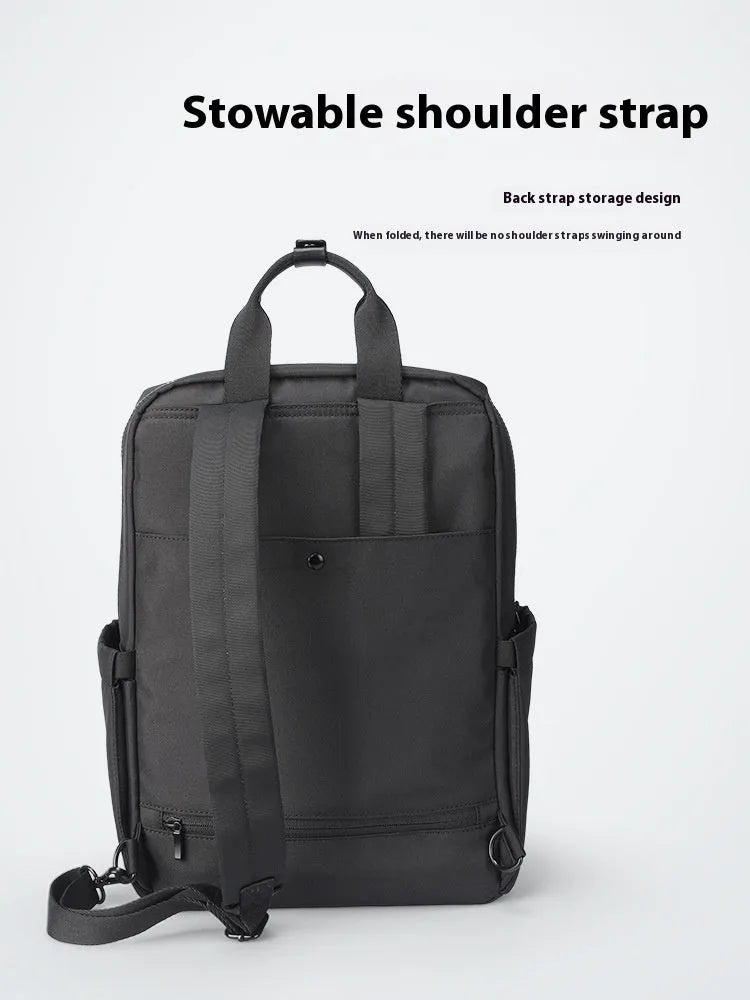 Black Oxford cloth computer backpack showing main compartment and 20-35 litre capacity.