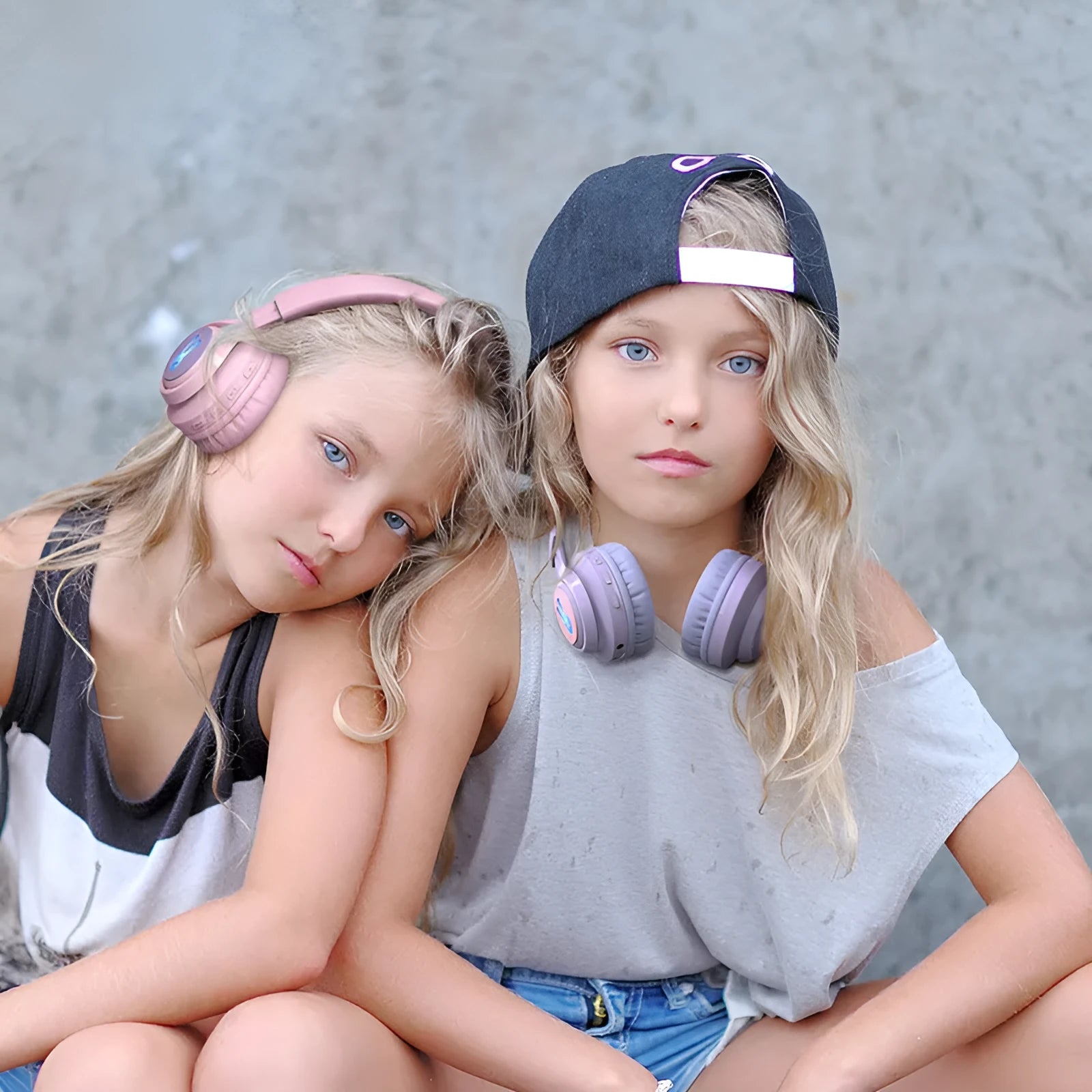 Wireless children's headphones with RGB LED lights in bunny pink colour showing power display