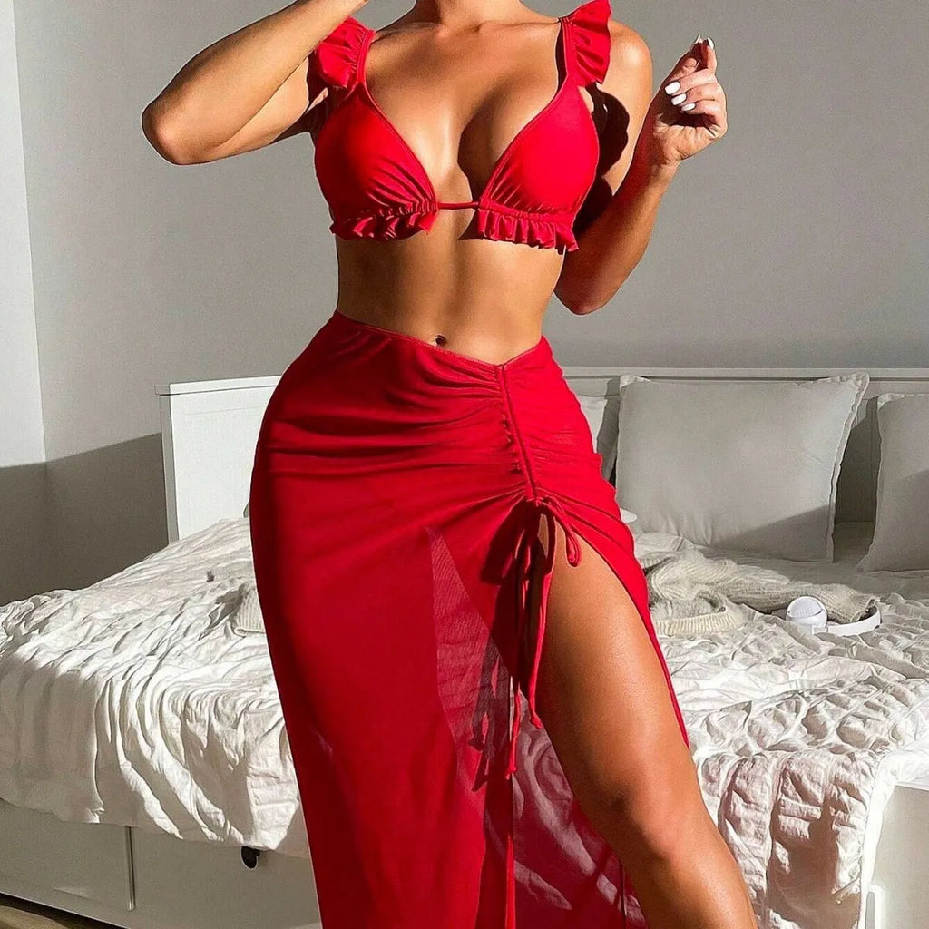 Women's printed three-piece swimsuit set consisting of a bikini top, bottoms, and a matching skirt.