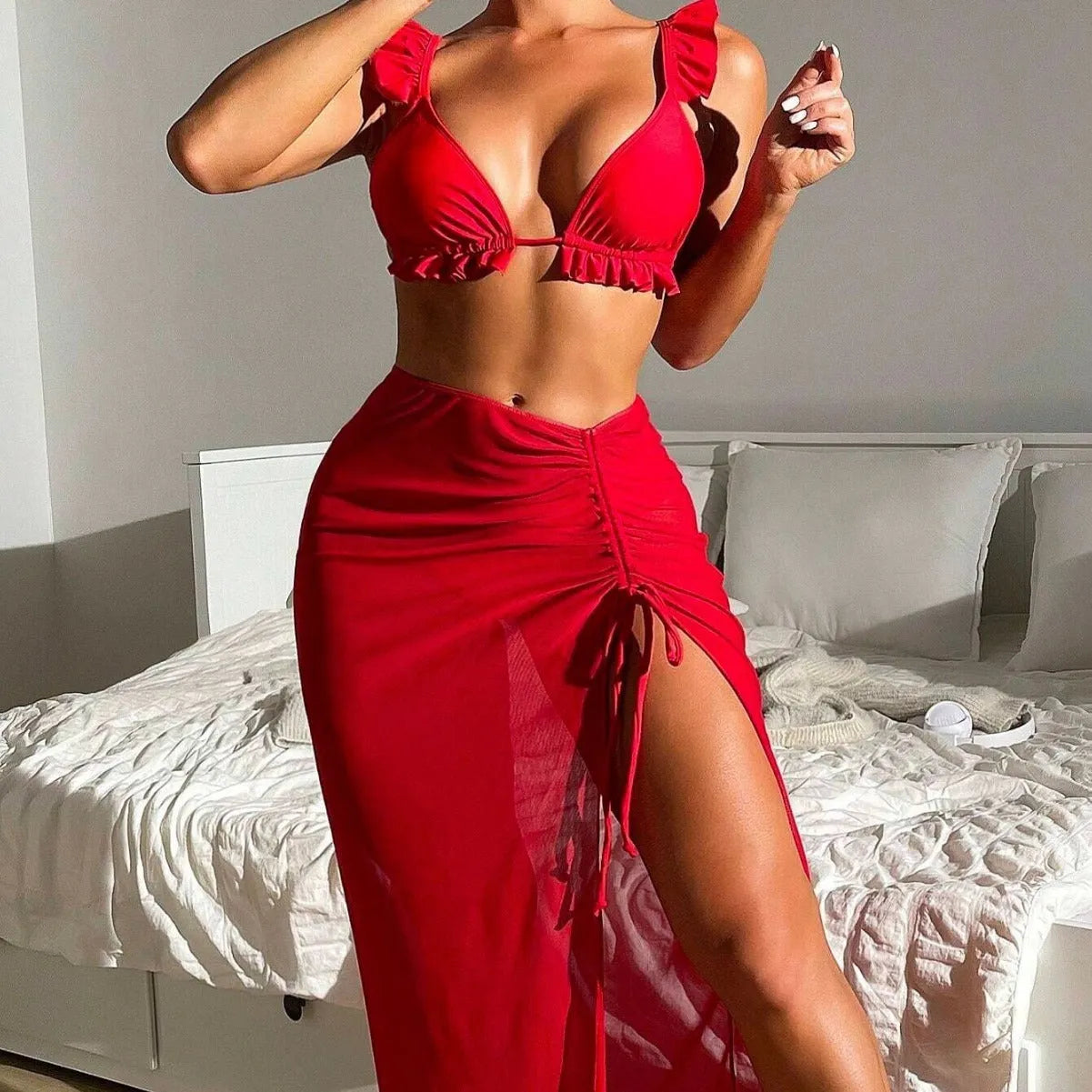 Women's printed three-piece swimsuit set consisting of a bikini top, bottoms, and a matching skirt.