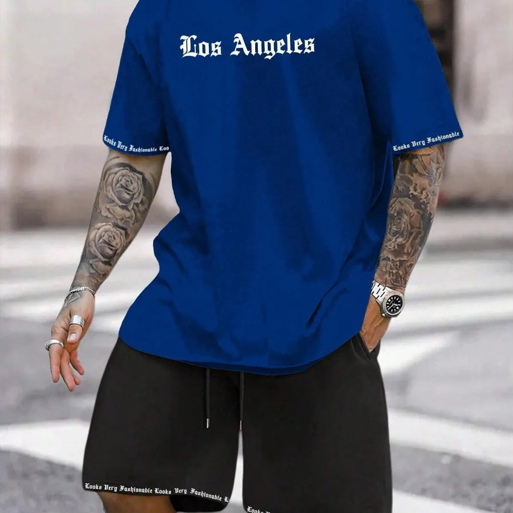 Man wearing a grey short sleeve athletic top and matching shorts from a polyester sportswear set.