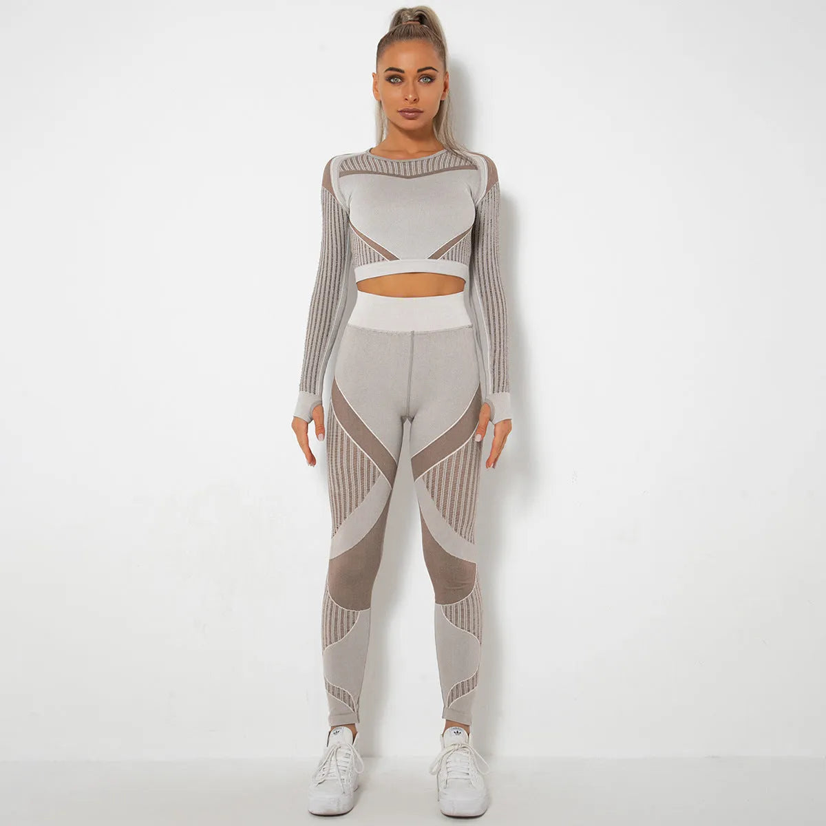 Seamless knitted long-sleeved yoga suit for women in a solid colour, showing full-length design.