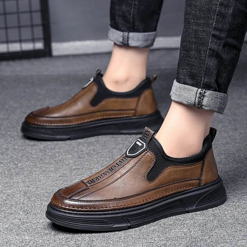 Men's casual leather shoes with round toe design in black or brown solid colours