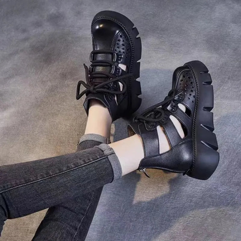 Women's black platform sandals with a hollow-hole leather upper and fish-mouth toe.