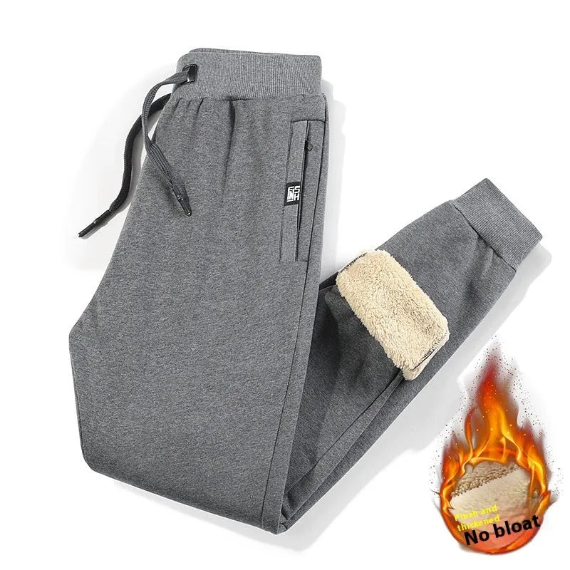 Men's gray fleece-lined oversized track pants with elastic waistband and straight leg