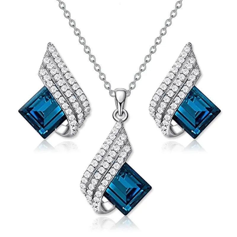 Women's alloy and glass necklace with matching ear studs featuring cross chain design