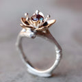 Two-tone floral geometric women's ring in silver colour, alloy construction, shown at angle