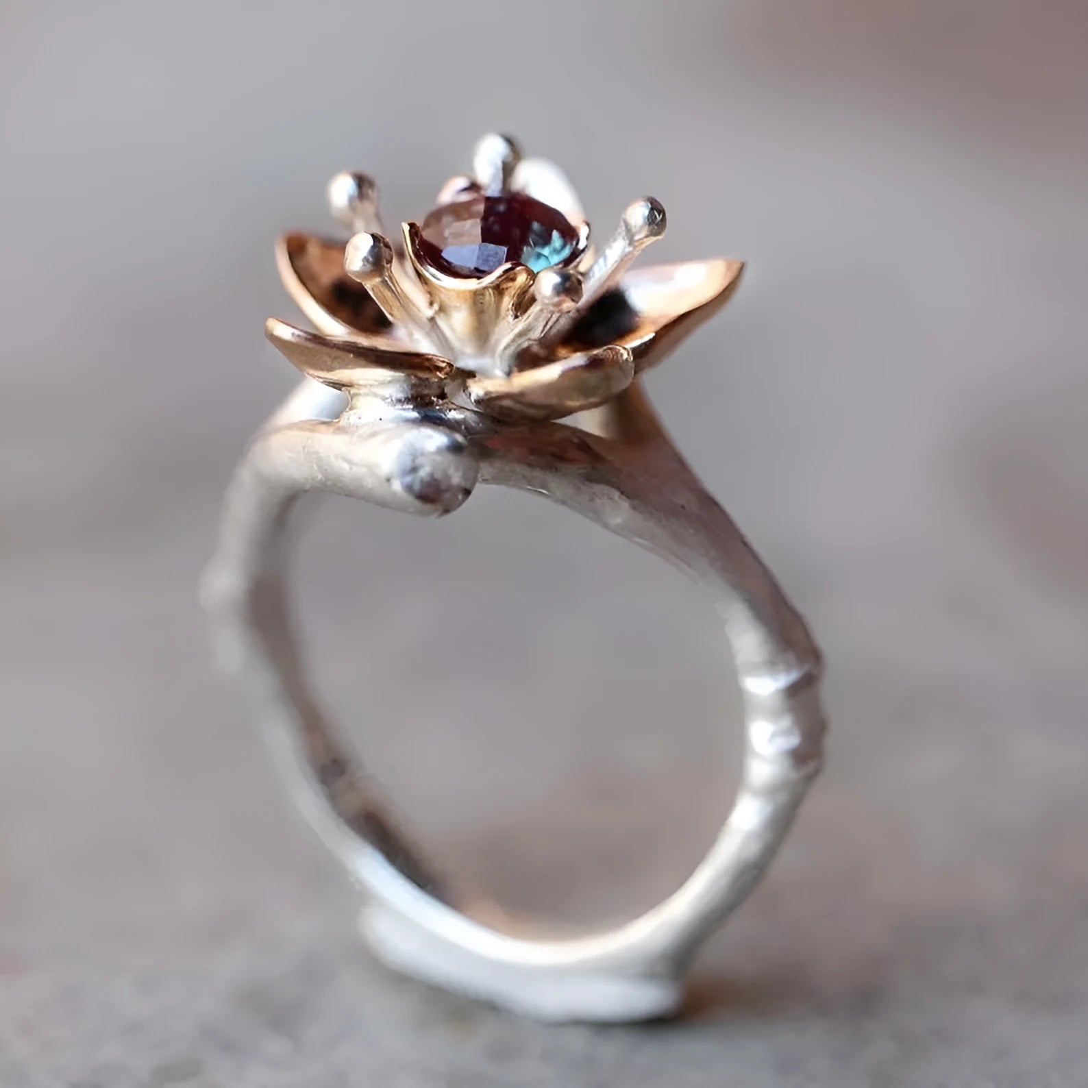 Two-tone floral geometric women's ring in silver colour, alloy construction, shown at angle