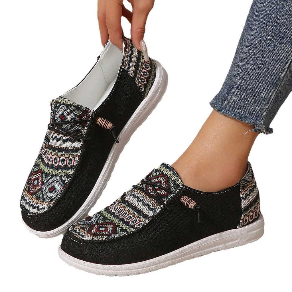 Women's black low-top flat shoes with round toe and artificial PU upper