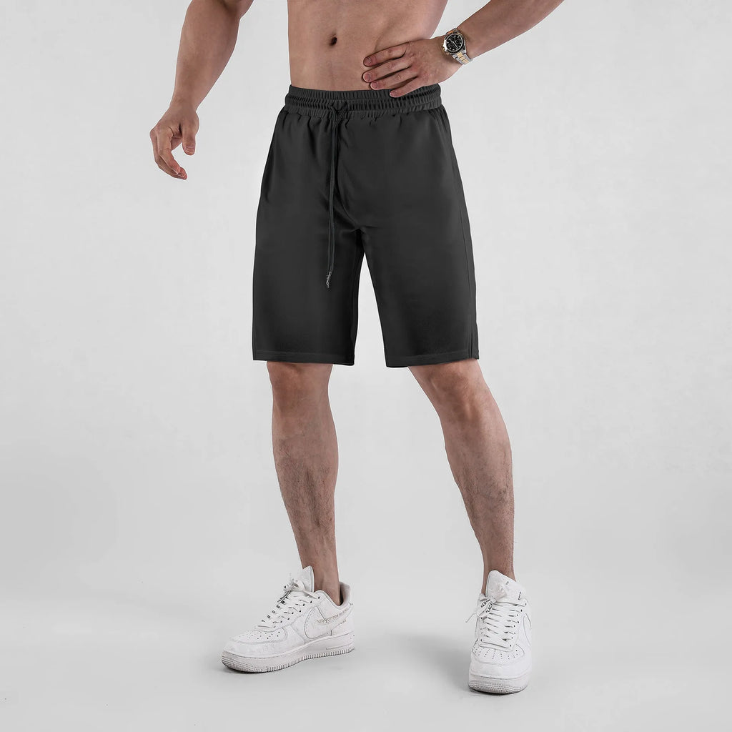Men's black quick-drying mesh shorts with elastic waistband and loose casual fit