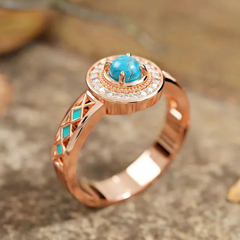 Women's geometric turquoise copper ring with rose gold plating and a micro inlaid zircon detail.
