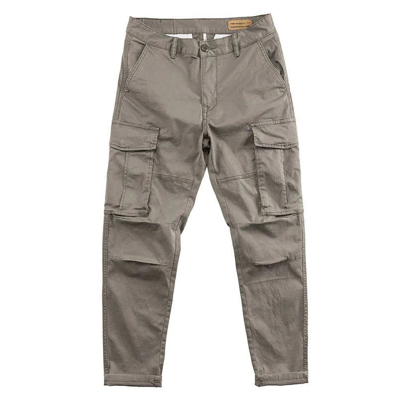 Men's solid colour cotton labour protection trousers in cropped length with multiple pockets, shown in khaki.
