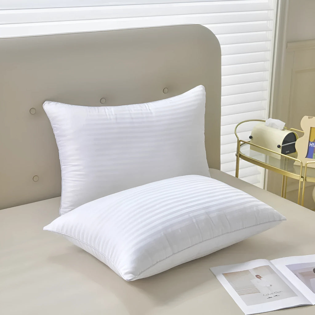 White hotel cotton satin stripe feather pillow showing 2cm stripe detail, shown in three sizes.