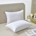 White hotel cotton satin stripe feather pillow showing 2cm stripe detail, shown in three sizes.