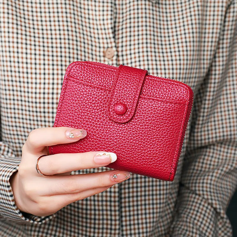 Women's short wallet in PU with lychee pattern, shown in beige, pink, black, and red colour options.
