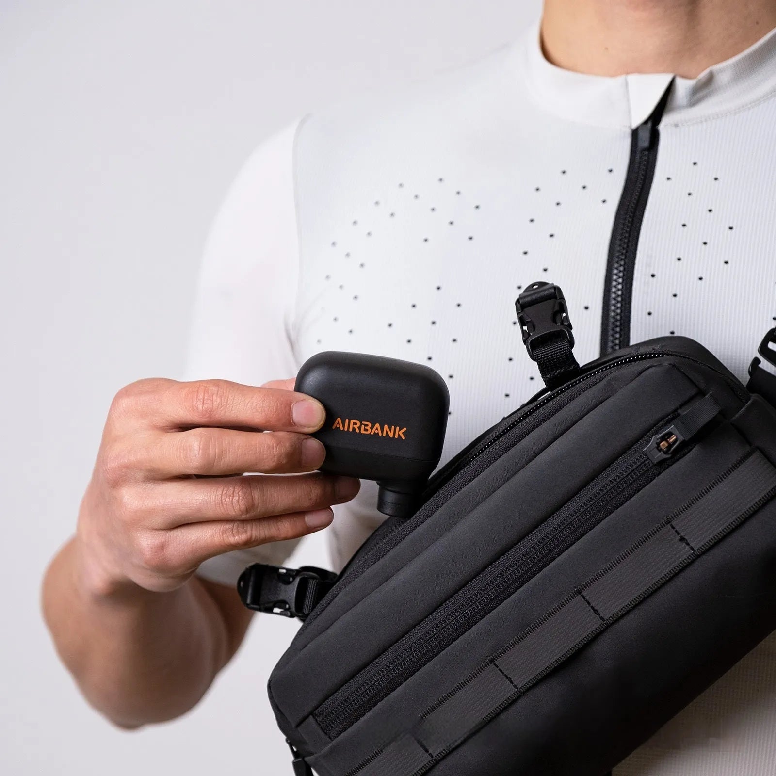 Black plastic USB-rechargeable electric bicycle tyre inflator pump with charging cable and waterproof bag