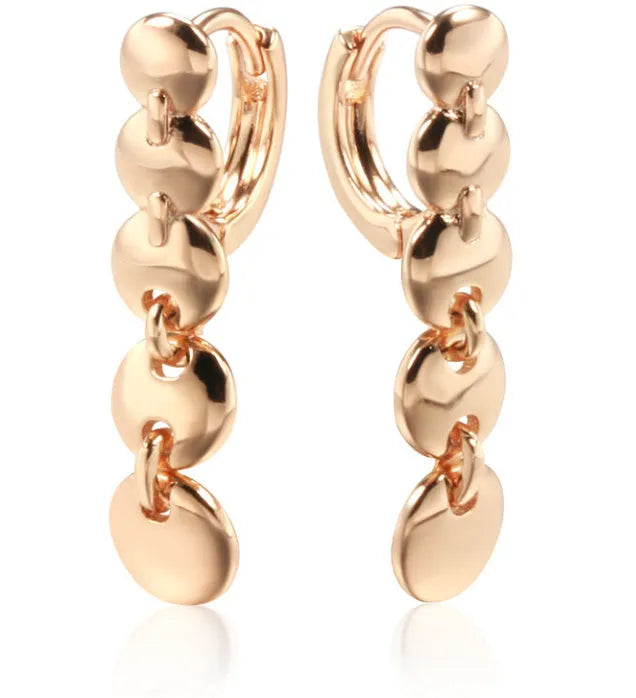 A pair of gold-coloured retro long round circle earrings with a woven texture, made from copper.