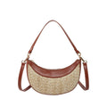 Hard straw women's crossbody dumpling bag in black with contrast stitching and single shoulder strap.