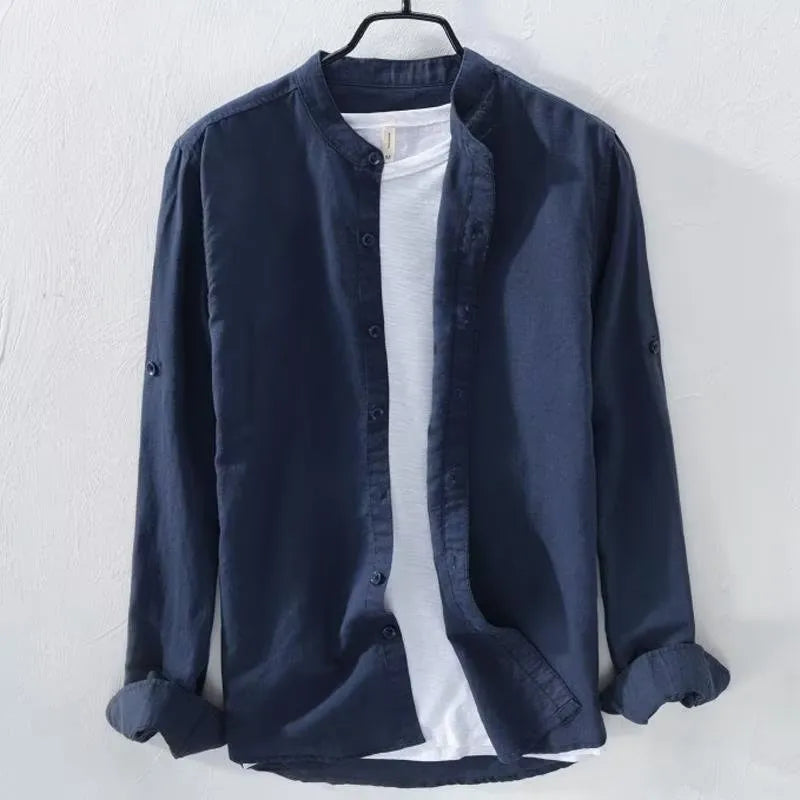 A man's loose fit long sleeve casual shirt in a cotton linen blend, shown in a solid colour.