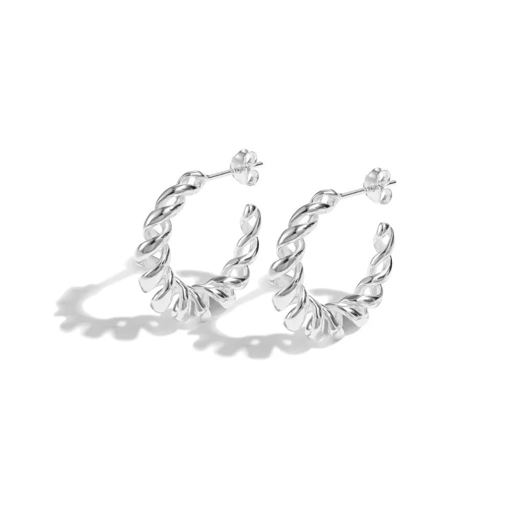 Argent Pur 925 silver ear studs with electroplated silver finish on a neutral background