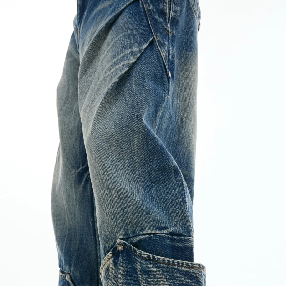 Men's Verdant Blue loose fit jeans with retro washed burst pattern and curved knife design
