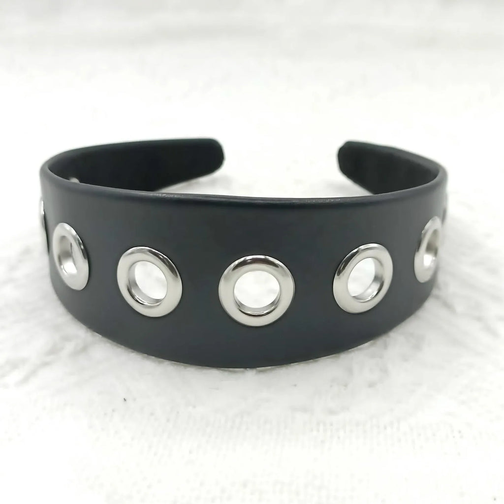 Black faux leather wide version women's headband with round, square, and dotted rivets