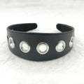 Black faux leather wide version women's headband with round, square, and dotted rivets
