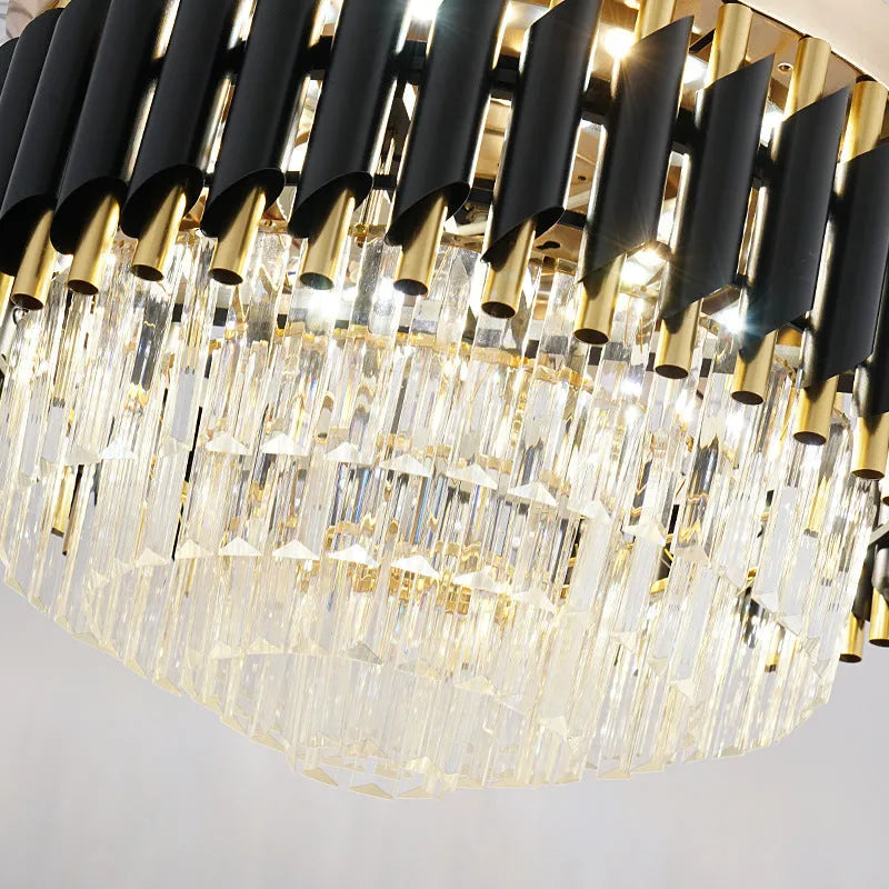 Crystal chandelier style ceiling fan light with remote control on a white ceiling.