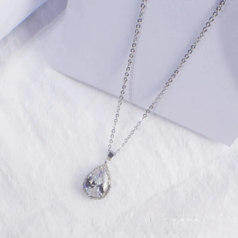 Drop-shaped pendant necklace with rhinestone and gemstone inlay in pink colour option