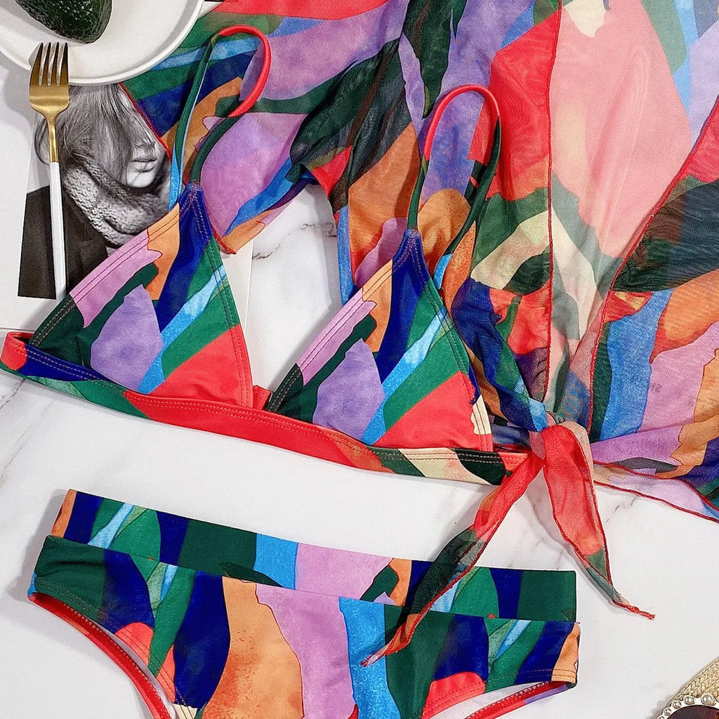 Red printed nylon split swimsuit for women, shown in a briefs-style bikini cut.