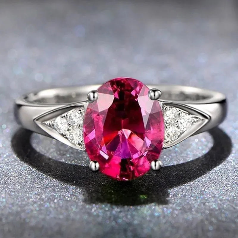 Red and blue zircon ring with natural stones in heart pattern and court style setting
