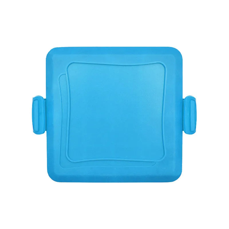 Red silicone baking tray with matching anti-scald gloves on kitchen counter