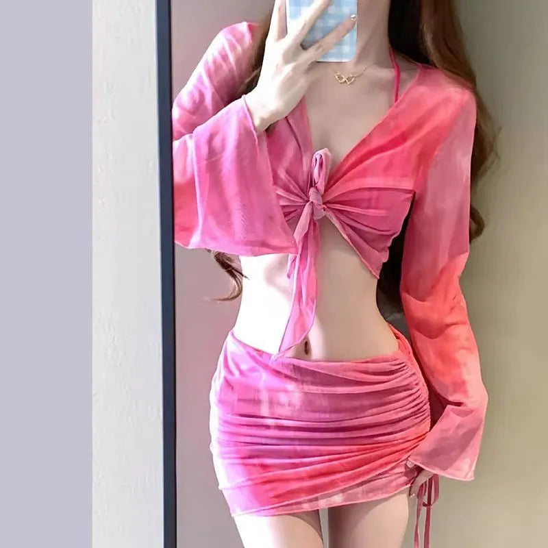Women's blue high-waist bikini four-piece swimsuit set showing shirt, bra, underwear, and skirt components