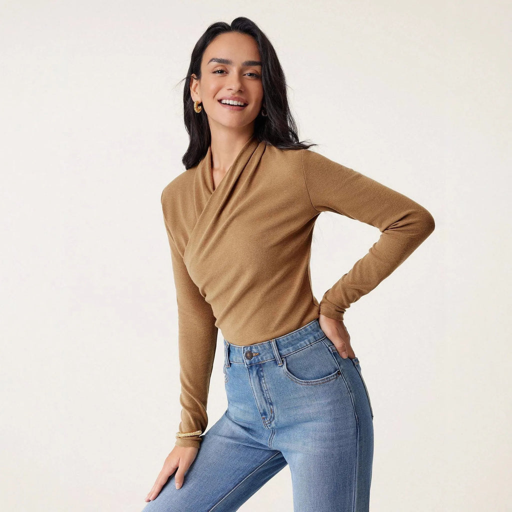 Camel-colour women's slim fit long sleeve pullover sweater on a hanger
