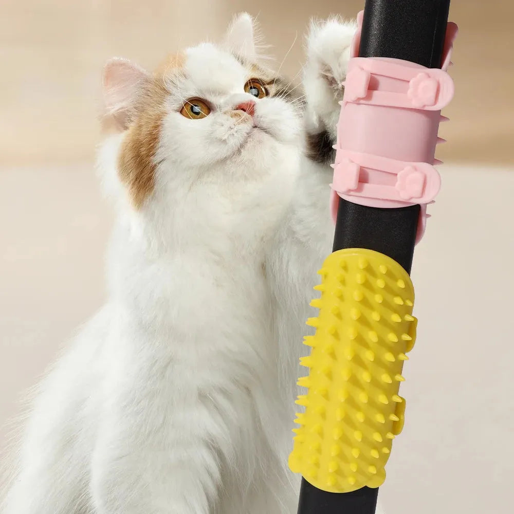 Silicone cat grooming comb scratcher with adjustable strap mounted on a table leg