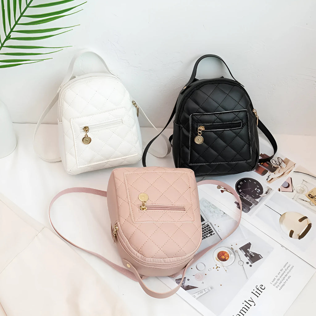 Girls square hard PU backpack with embroidery detail in black, pink or white, showing soft handle and outer pocket.