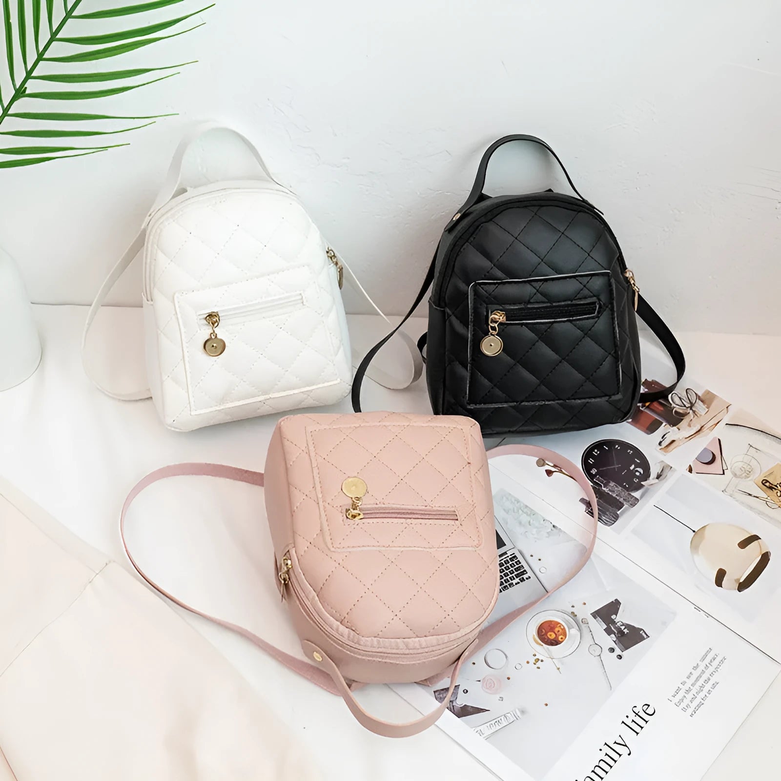 Girls square hard PU backpack with embroidery detail in black, pink or white, showing soft handle and outer pocket.