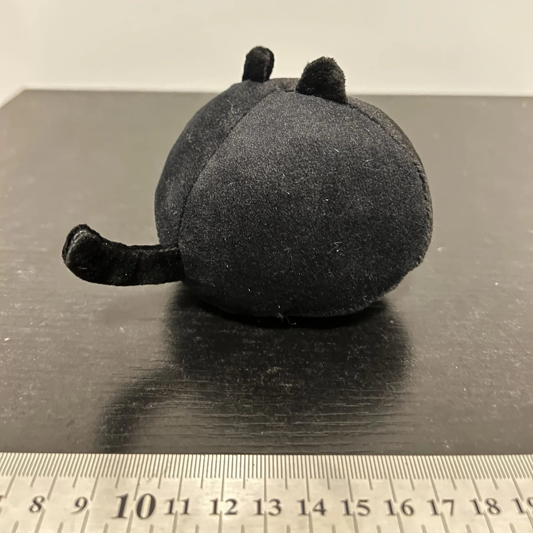 Fluffy black cat plush toy pillow cushion measuring 35 cm in length